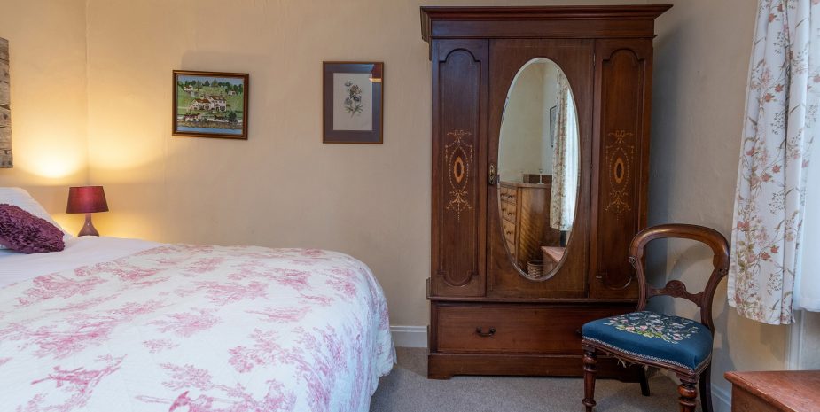 Master bedroom with antique wardrobe